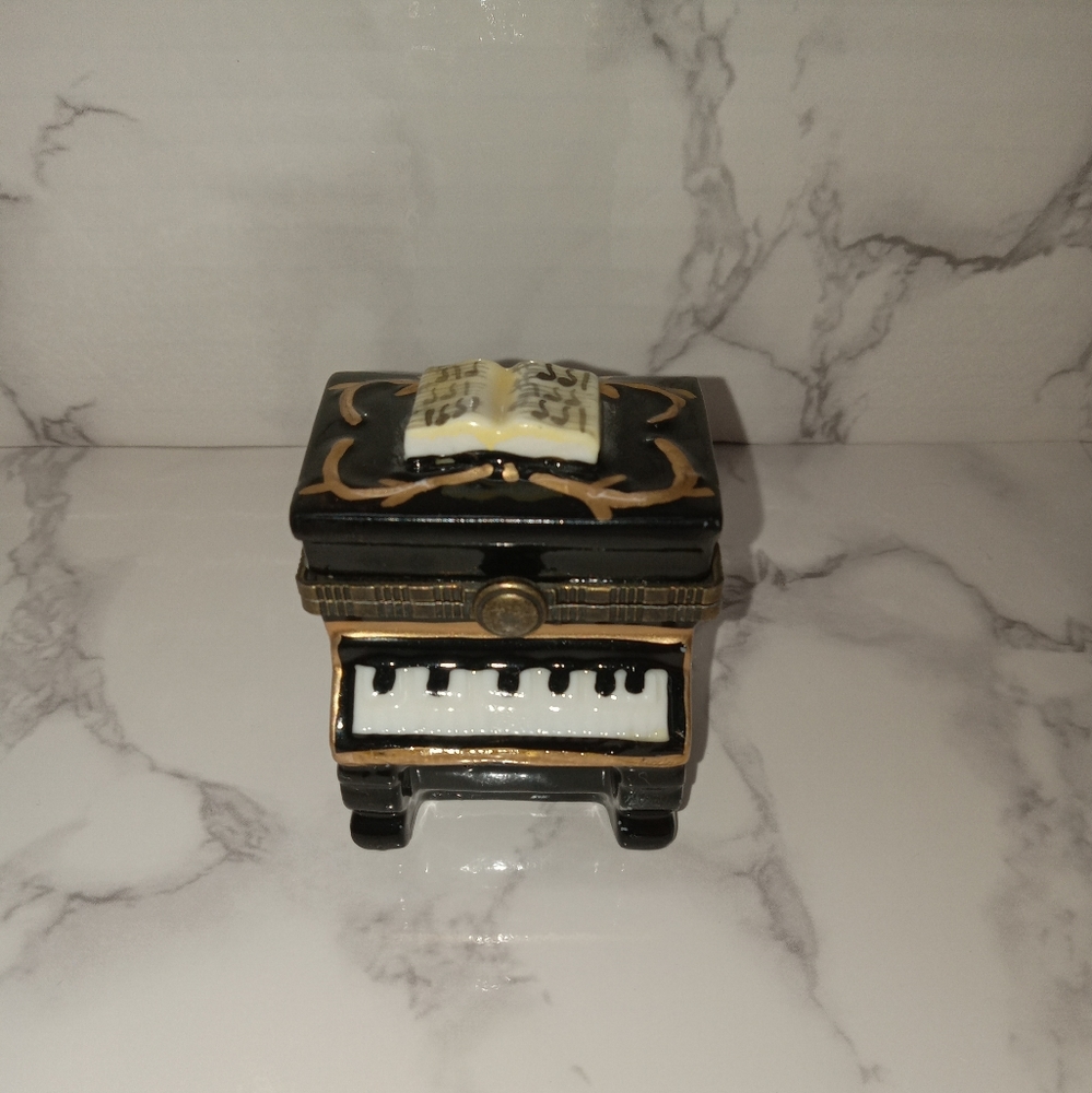 Piano with song book and gold tone accents trinket box